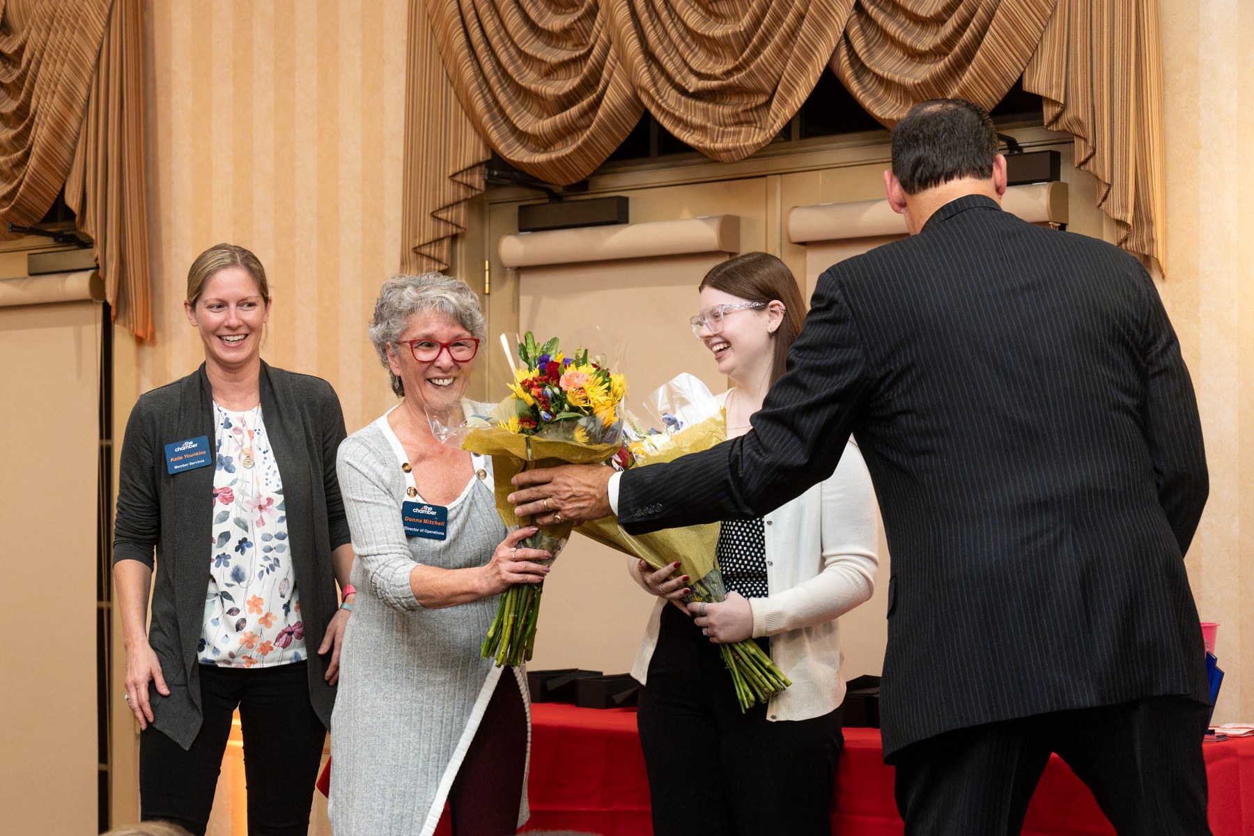 An honoree receiving recognition on stage at the Chamber Annual Meeting